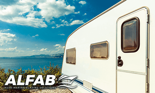Caravan windows close up overlooking ocean